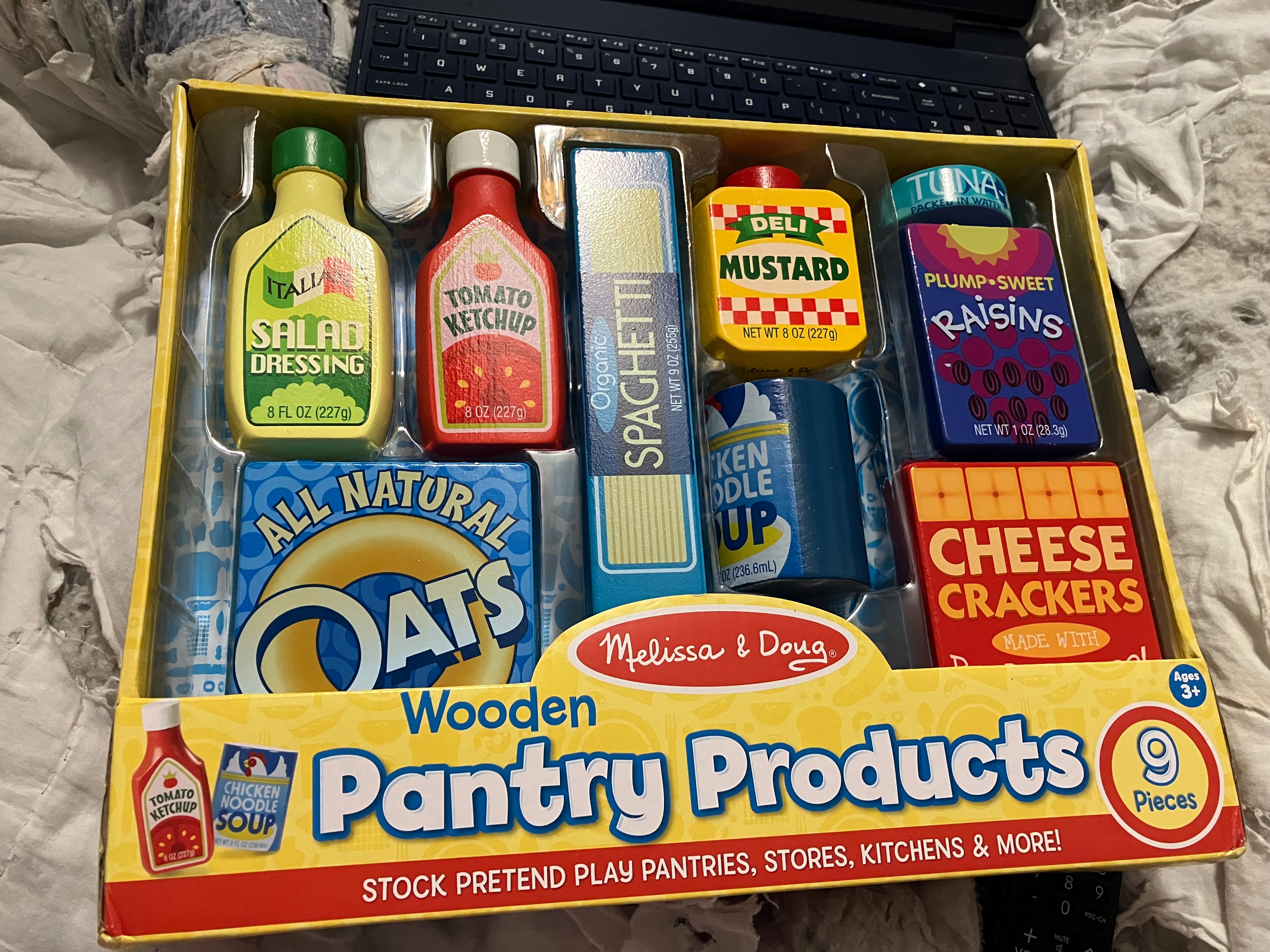 Box of wooden play food.